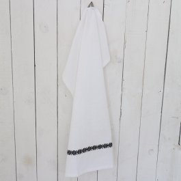 vacker vit handduk med broderad blombård i svart färg